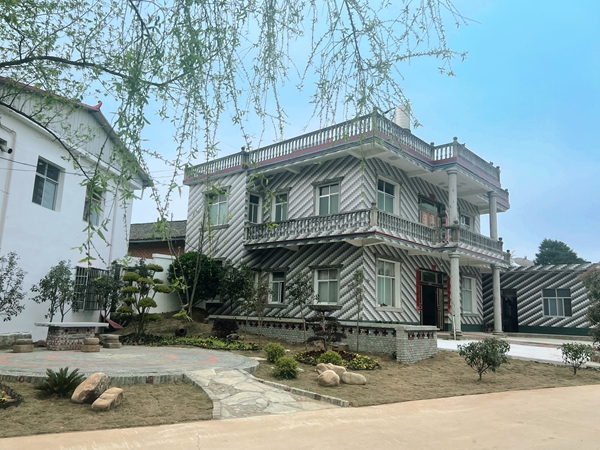 信阳市商城县余集镇人居环境整治展开美丽乡村新画卷